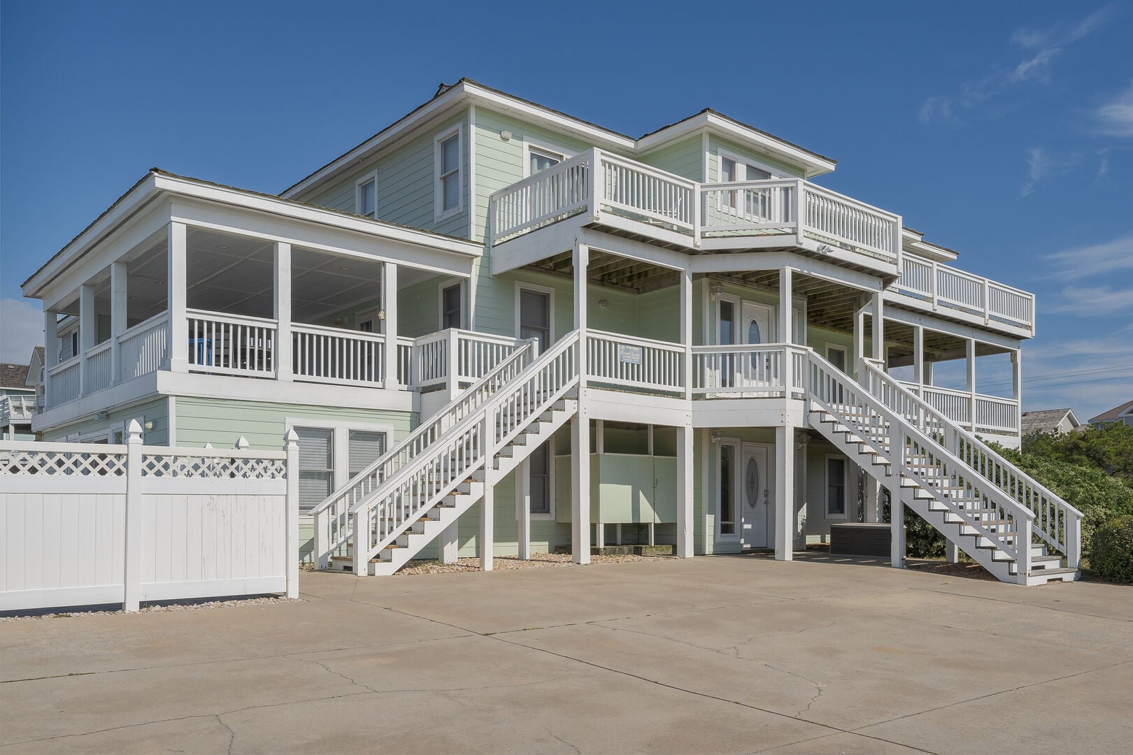Coastal beach home with ocean-view porch seating